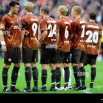 players-of-fc-st-pauli-building-a-defense-wall-BR376J